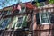 Three historic American Flags on the side of old brick buildings