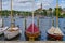 Three historic ships sail in the harbor winterized under cover