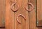 Three horseshoes on the barn door, lucky horseshoes