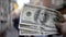 Three hundred dollar bills on blurred background of european