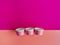 three ice cream cups with empty colored polka dots