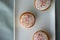 Three Iced Fairy Cakes on a white tray