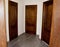 Three identical wooden doors, all closed. The concept of choosing a solution. Find the answer, open the right door. The