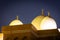 Three illuminated domes of Grand Mosque in Dubai Grand Bur Dubai Masjid at night, Dubai, UAE. Copy space