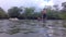 Three Indigenous Children Trying To Stand In A Floating Inner Tube