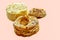 Three individual french patisserie isolated on a plain background