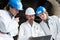 Three industrial engineers looking at laptop