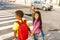 Three international kids ready to cross road