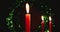 Three isolated candles are lit with a dark abstract bokeh background. Great for a Christmas background