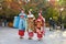 Three japanese girls dressing as Geisha in a park in Kyoto