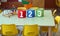 Three jar with big writing 1 2 3 into a kindergarten classroom w