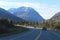 THREE JEEPS ON MOUNTAIN HIGHWAY SNOW PEAKS FORREST