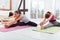 Three joyful girls training in a fitness studio