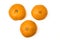 Three juicy tangerines lined up in a triangle. Isolated on a white background. Top view