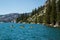 Three kayakers on Echo Lake in Sierra Nevada mountains, California, USA
