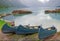 Three kayaks standing near the scenic mountain lake.