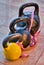 Three kettlebells on flagging