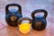 Three kettlebells on flagging