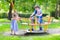 Three kids on a swing