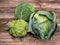 Three kinds of cabbage on old wooden background