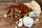 Three kinds of cheese and various vegetable on wooden board