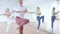 Three ladies of different ages dancing together in light dance studio indoor