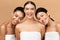 Three Ladies Wrapped In Bath Towels Posing On Beige Background