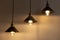 Three lamps with vintage incandescent bulbs with warm light