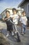 Three Latino children with their scooter, Los Angeles, CA