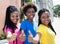 Three laughing african american girlfriends showing thumbs up