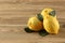 Three lemon on a wooden table with copy space for your text