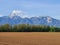 Three levels of composition: the plowed field, the forest and the mountains