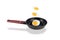 Three levitating fried eggs over frying pan, isolated on white background