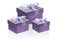 Three lilac gift boxes isolate on a white background, close-up, reflection