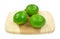 Three Limes On Cutting Board