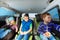 Three little boys sitting in safety car seats