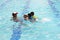 Three little boys with swim instructor