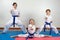 Three little girls demonstrate martial arts working together