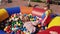 Three little girls jump in children trampoline filled with color balls. Fest