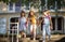 Three little girls leaving school building