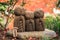 Three little monk rock carving statue in autumn