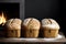 Three loaves of bread sitting on a table in front of a fireplace.