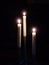 Three Long Lit White Candles