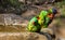 Three lorikeets get out of the bird bath