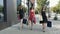 Three lovely young women walking down the street and enjoying their shopping day