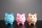 Three lucky piggy banks. Savings and deposit banking.
