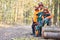 Three lumberjacks take a break at the wood harvest