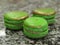 Three macaron cookies, green gold