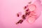 Three Macaron in a stack. French pasta on a pink background.