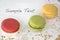 Three macarons with sample text